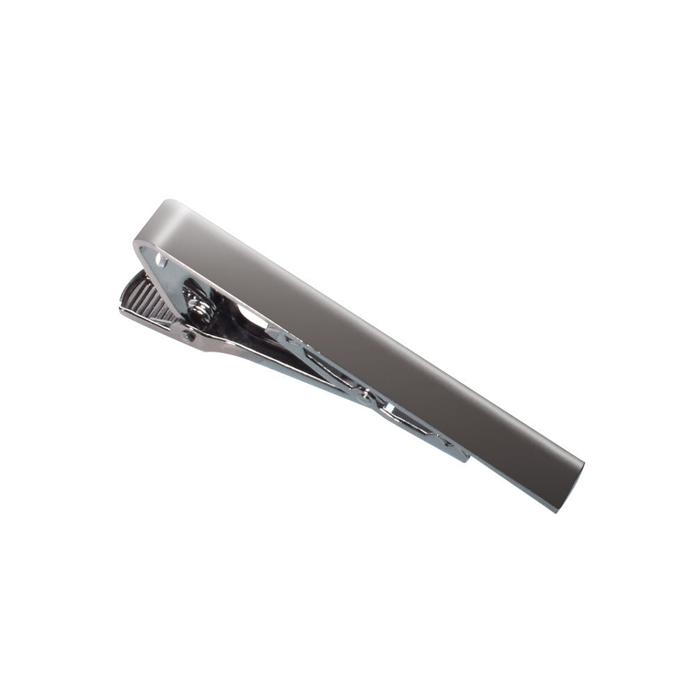 A polished silver-tone tie clip with a smooth front bar and hinged grip.