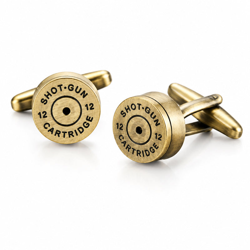 A pair of bronze-tone metal cufflinks styled like shotgun cartridge caps with engraved headstamp markings.
