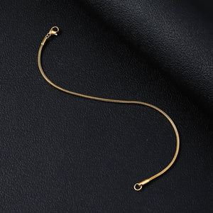 Gold-tone stainless steel snake chain bracelet with smooth weave and lobster clasp