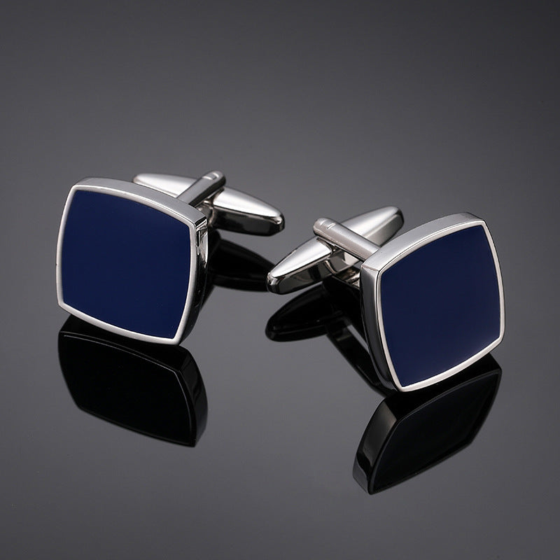 A pair of square silver-tone cufflinks featuring a polished navy blue enamel inlay and swivel T-bar backing.
