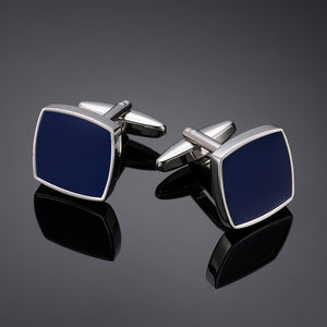 A pair of square silver-tone cufflinks featuring a polished navy blue enamel inlay and swivel T-bar backing.