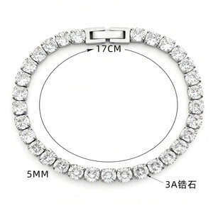 Silver-tone tennis bracelet with round zircon stones in prong settings and a box clasp