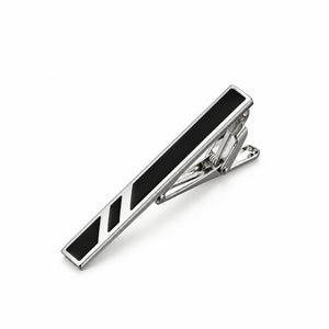 Silver-tone tie clip featuring a black enamel inlay and angled geometric details with a rear spring hinge