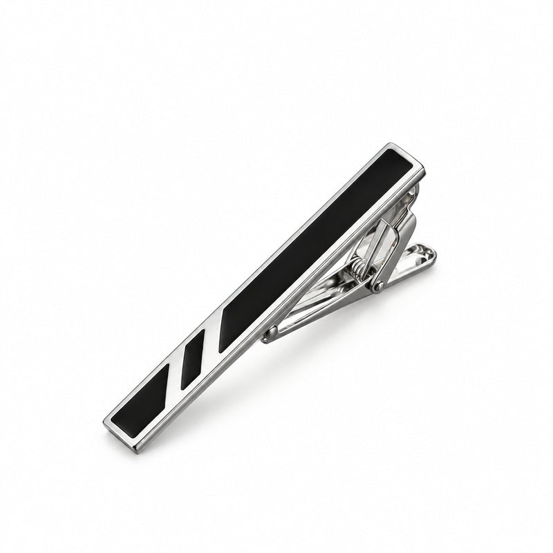 Silver-tone tie clip featuring a black enamel inlay and angled geometric details with a rear spring hinge