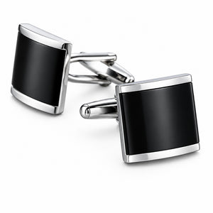 Silver-tone cufflinks featuring a curved black enamel insert inside a polished metal frame with a hinged T-bar fastening