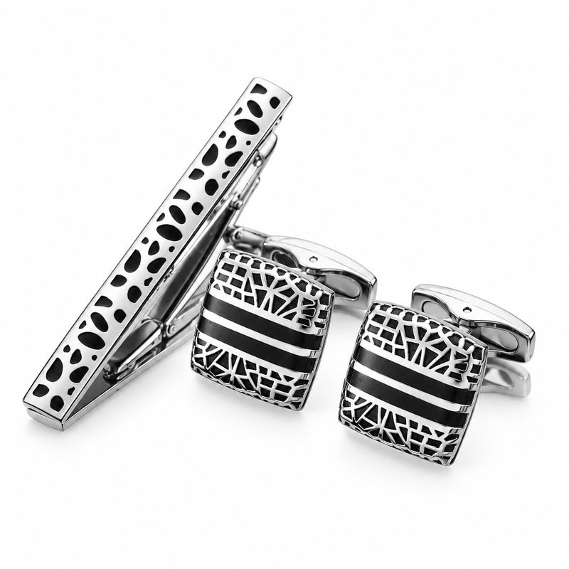 Silver-tone tie clip and square cufflinks with black enamel and geometric cut-out patterns