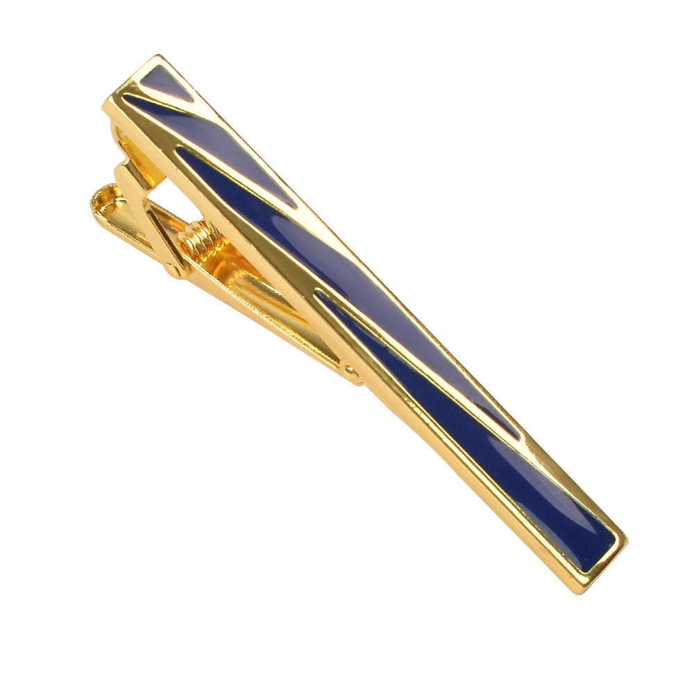Gold-tone metal tie clip featuring a polished finish and geometric blue enamel inlay patterns.