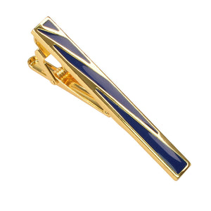 Gold-tone metal tie clip featuring a polished finish and geometric blue enamel inlay patterns.