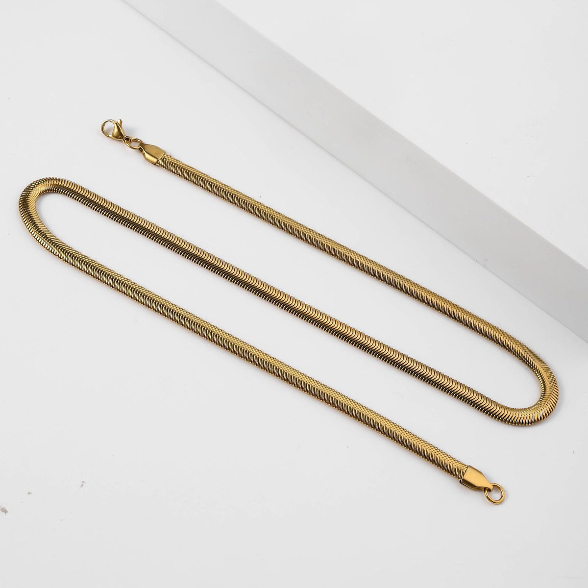 Gold-tone stainless steel round snake chain necklace with lobster clasp