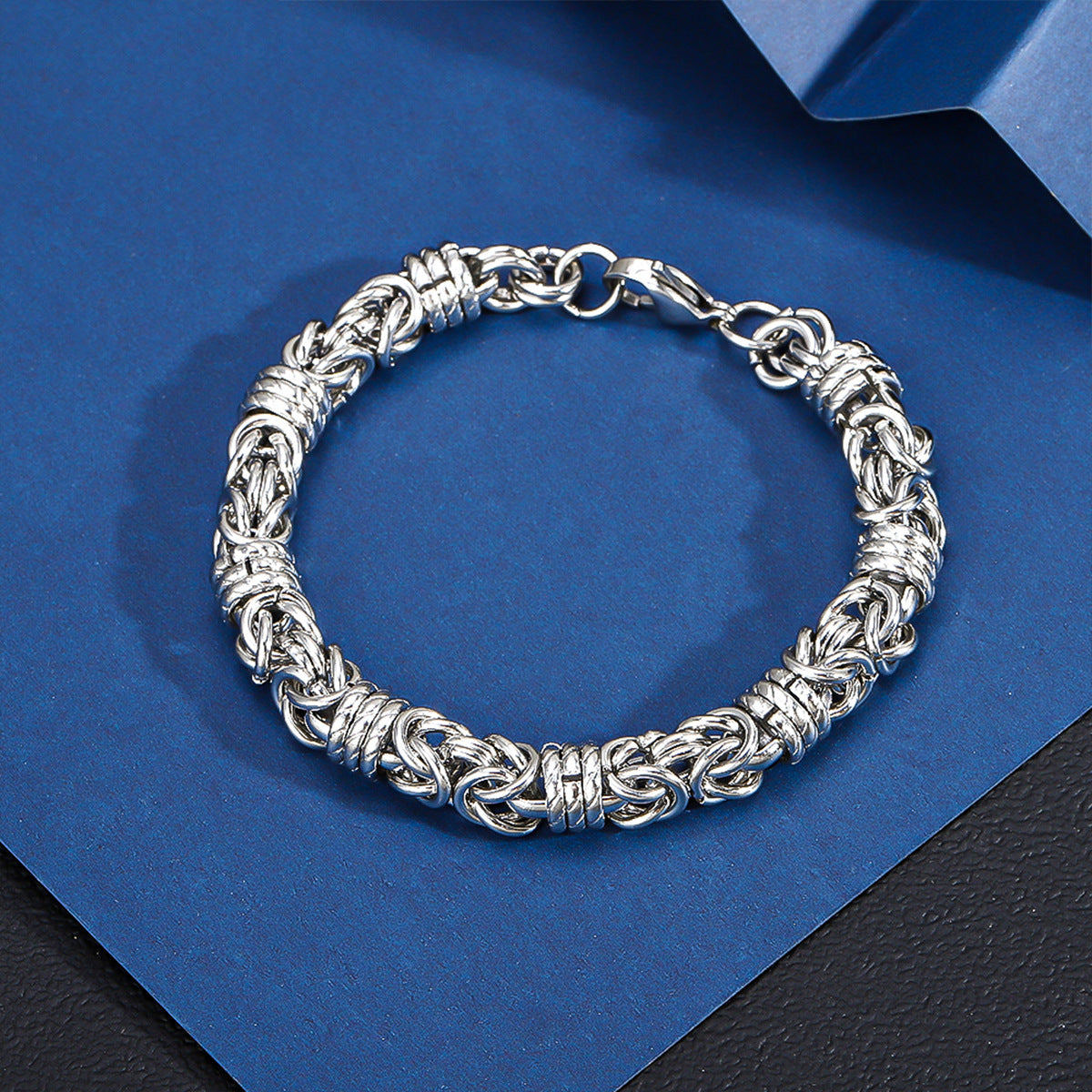 Silver-tone stainless steel Byzantine chain bracelet with a polished finish and lobster clasp