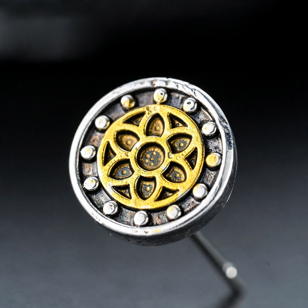 Steel Stud Earrings with Gold-Tone Floral Inlay - close-up detail