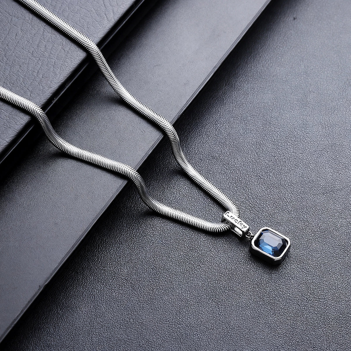 Silver-Tone Snake Chain Necklace With Blue Crystal Pendant - side angle