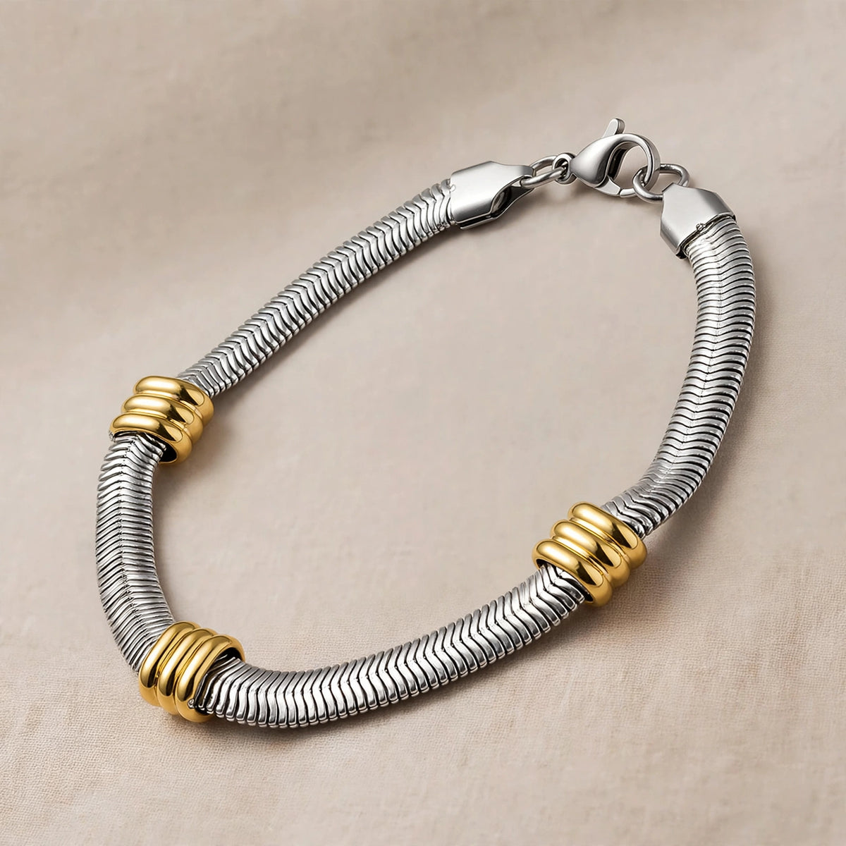 Silver-Tone Snake Chain Bracelet With Triple Gold-Tone Ring Accents